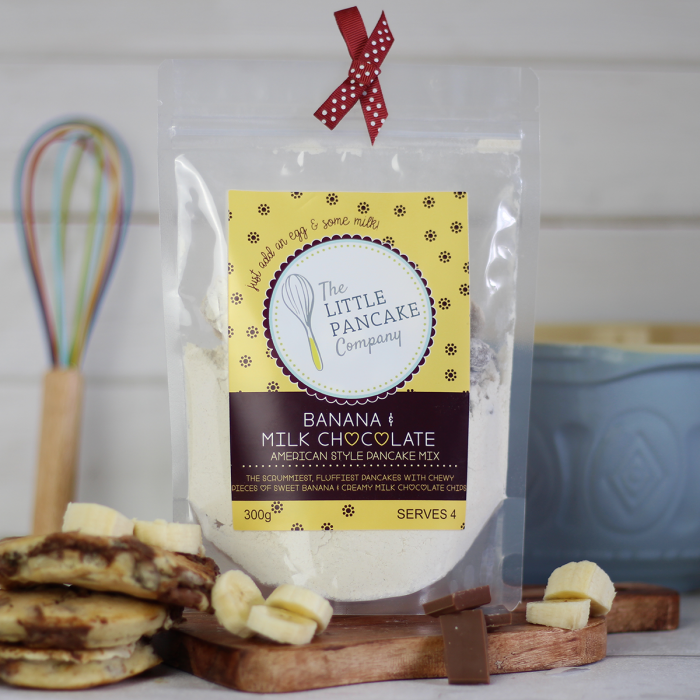 A tasty banana and milk chocolate pancake mix packaged in a recyclable plastic pouch.