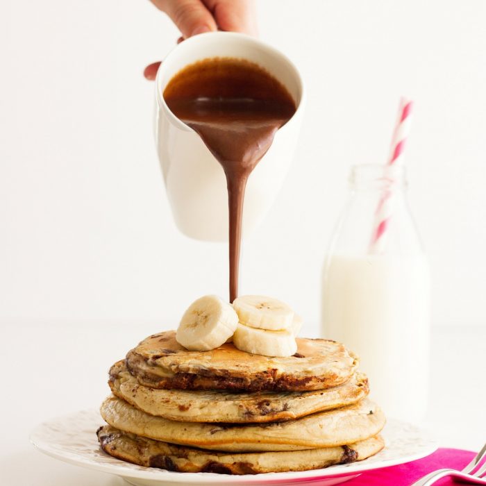 banana pancke stack with pouring sauce