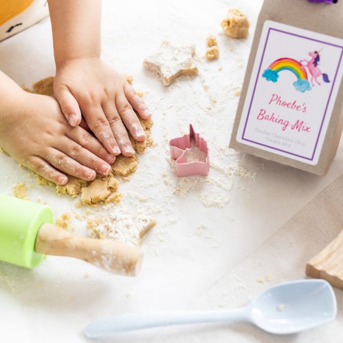 making unicorn biscuits with unicorn cookie cutter and cookie baking kit box